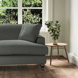 A grey stain resistant woven fabric on an armchair.