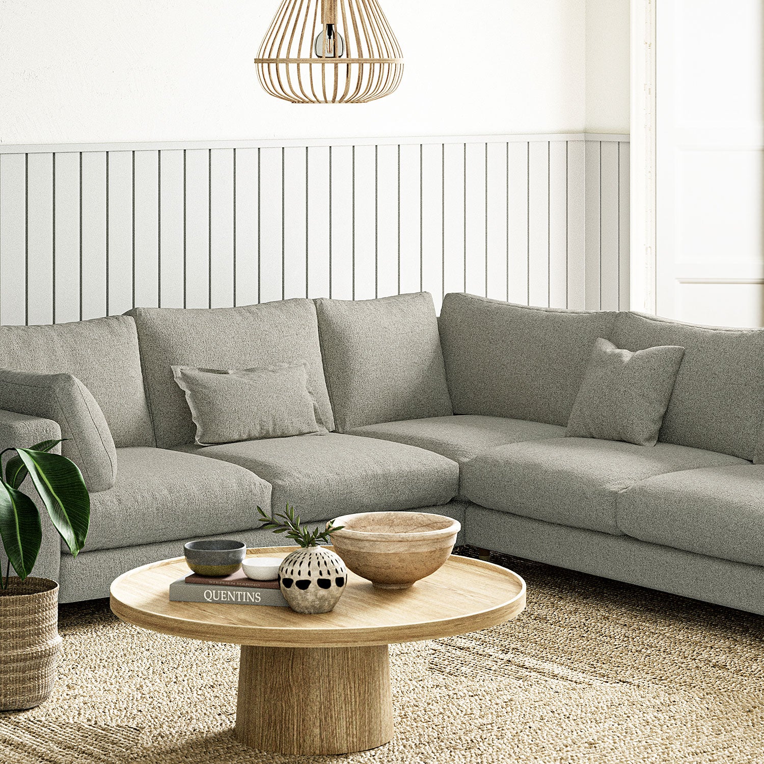 Sofa covered in a boucle fabric in Aluminium