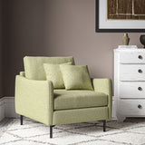 Chair covered in a boucle fabric in Peridot