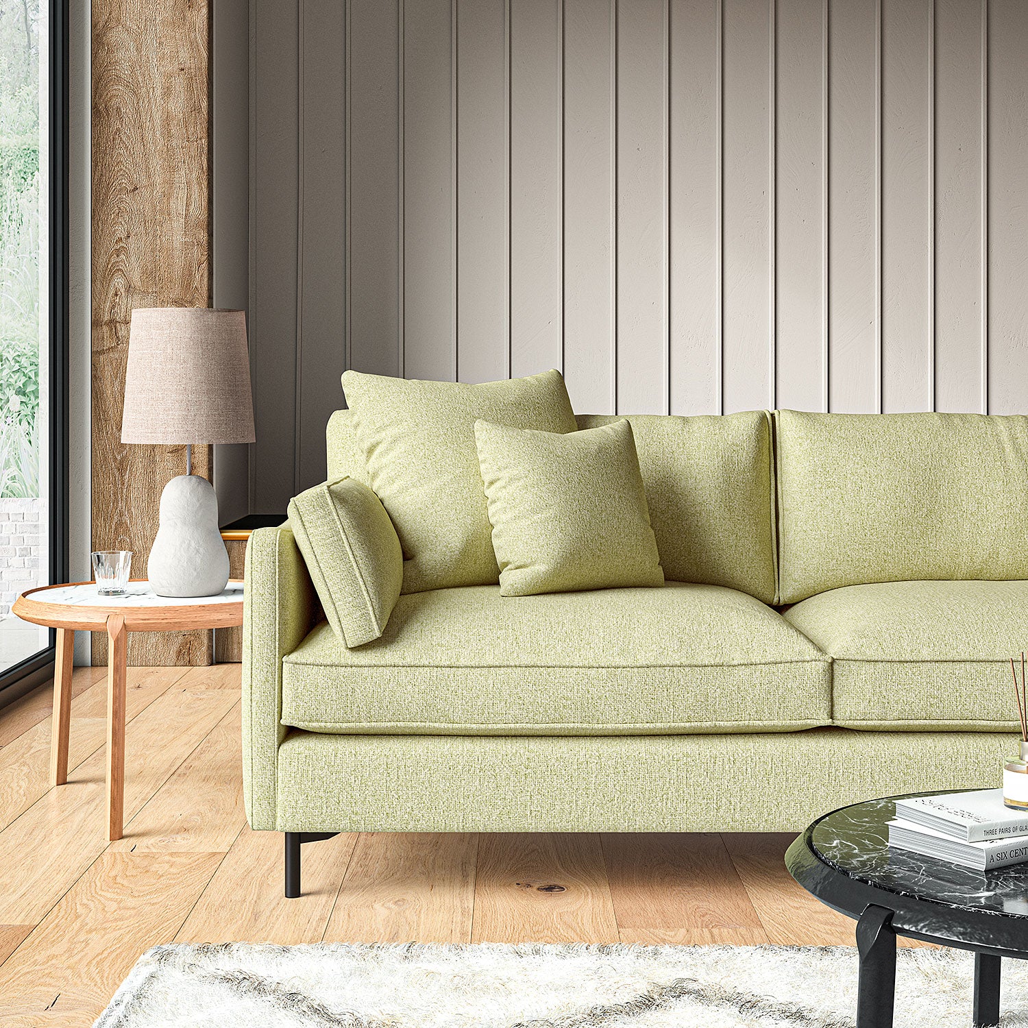 Sofa covered in a boucle fabric in Peridot