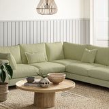 Sofa covered in a boucle fabric in Peridot