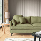 Sofa covered in a boucle fabric in Winter Moss
