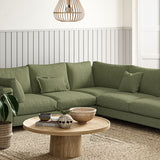 Sofa covered in a boucle fabric in Winter Moss