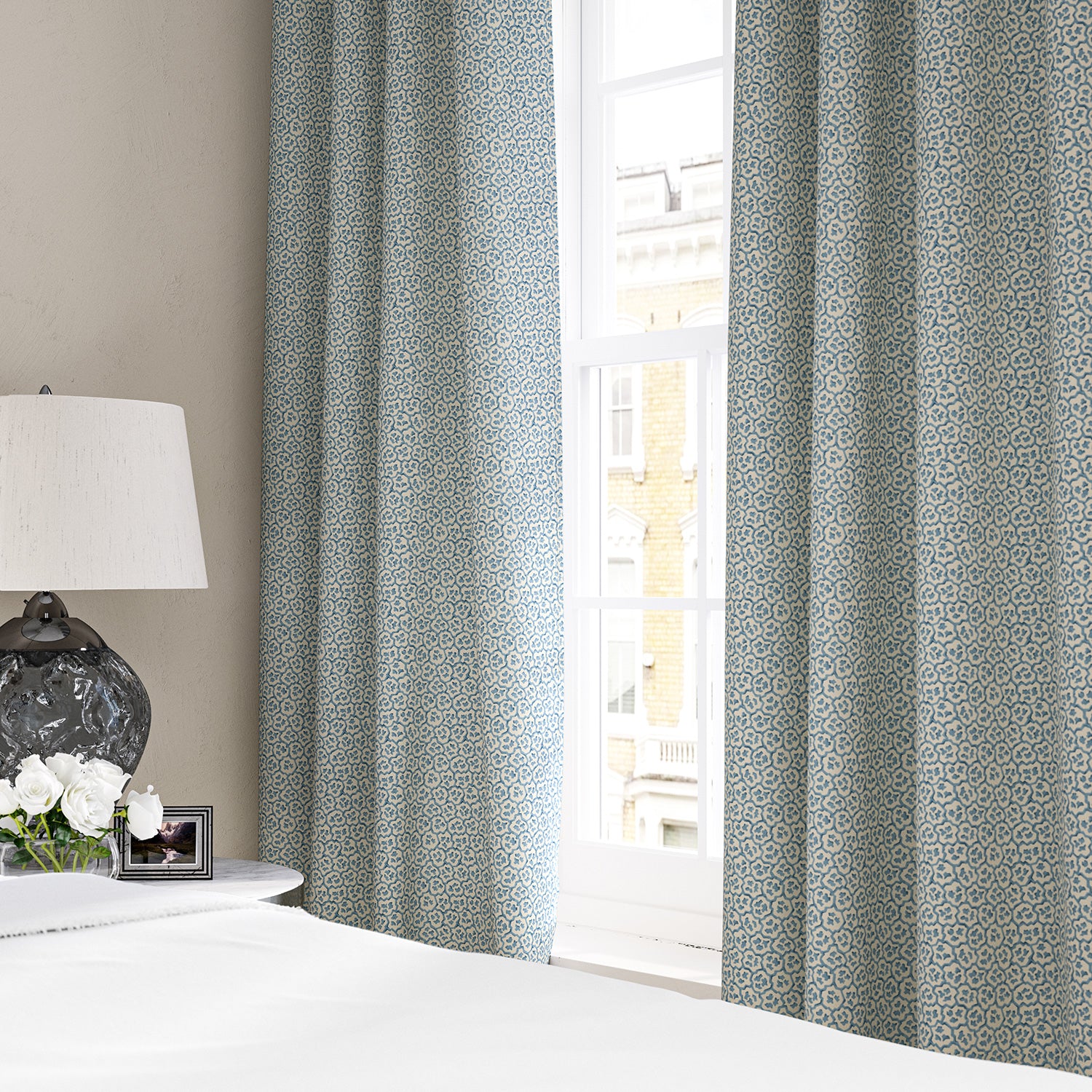 Linen curtains with a block print pattern in blue and cream