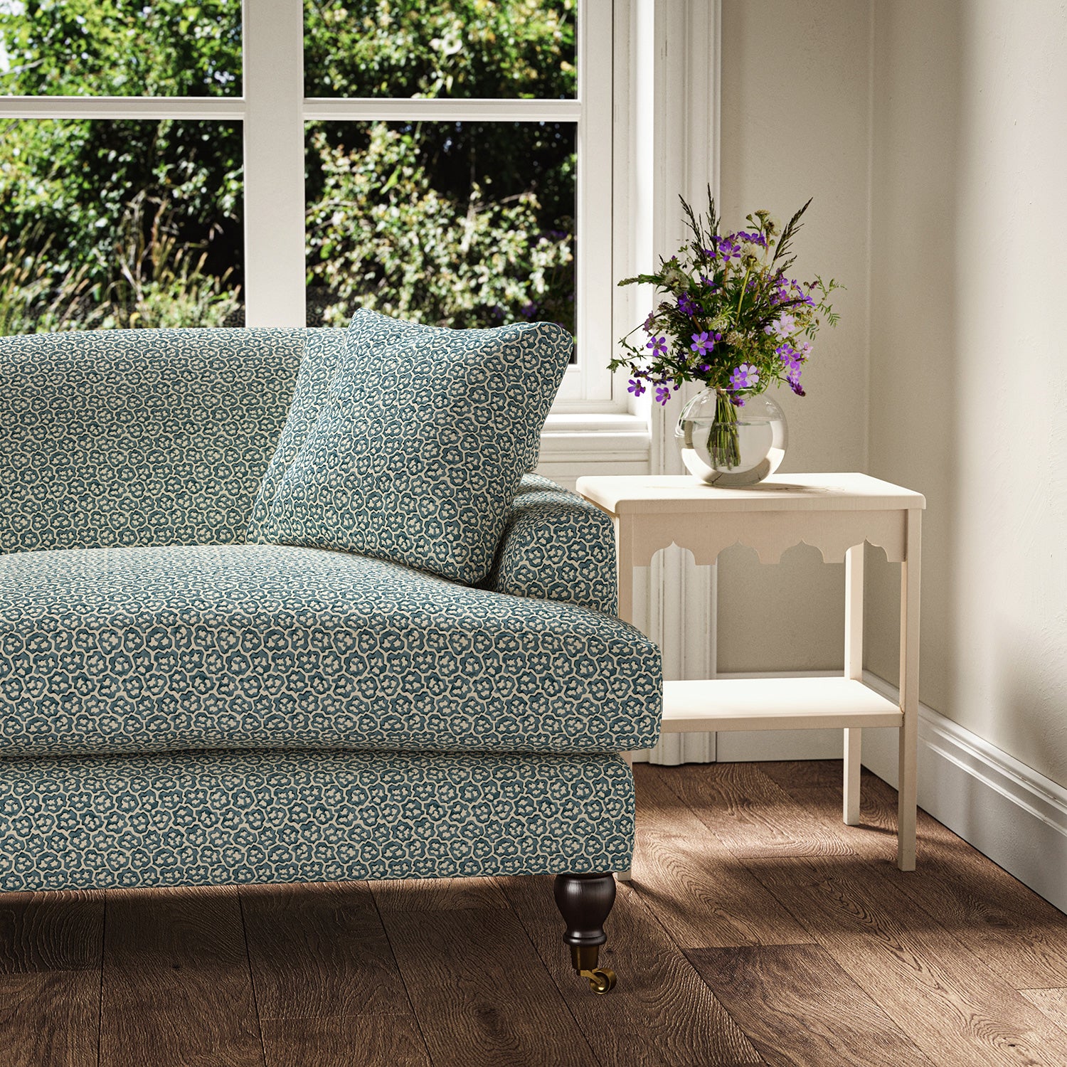 Printed linen fabric – a handy block print pattern in blue and cream – on a sofa