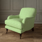 Printed linen fabric – a handy block print pattern in green and cream – on an armchair