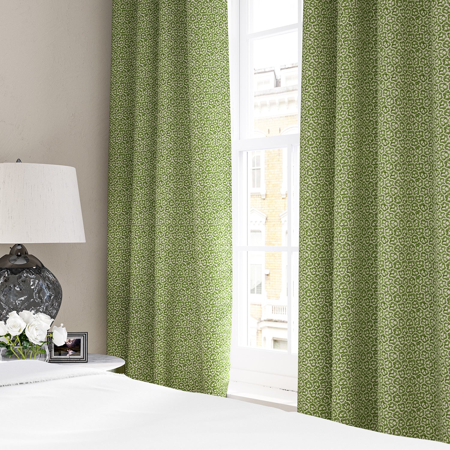 Linen curtains with a block print pattern in green and cream