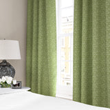 Linen curtains with a block print pattern in green and cream