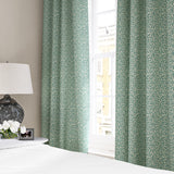 Linen curtains with a damask-style pattern in blue and cream