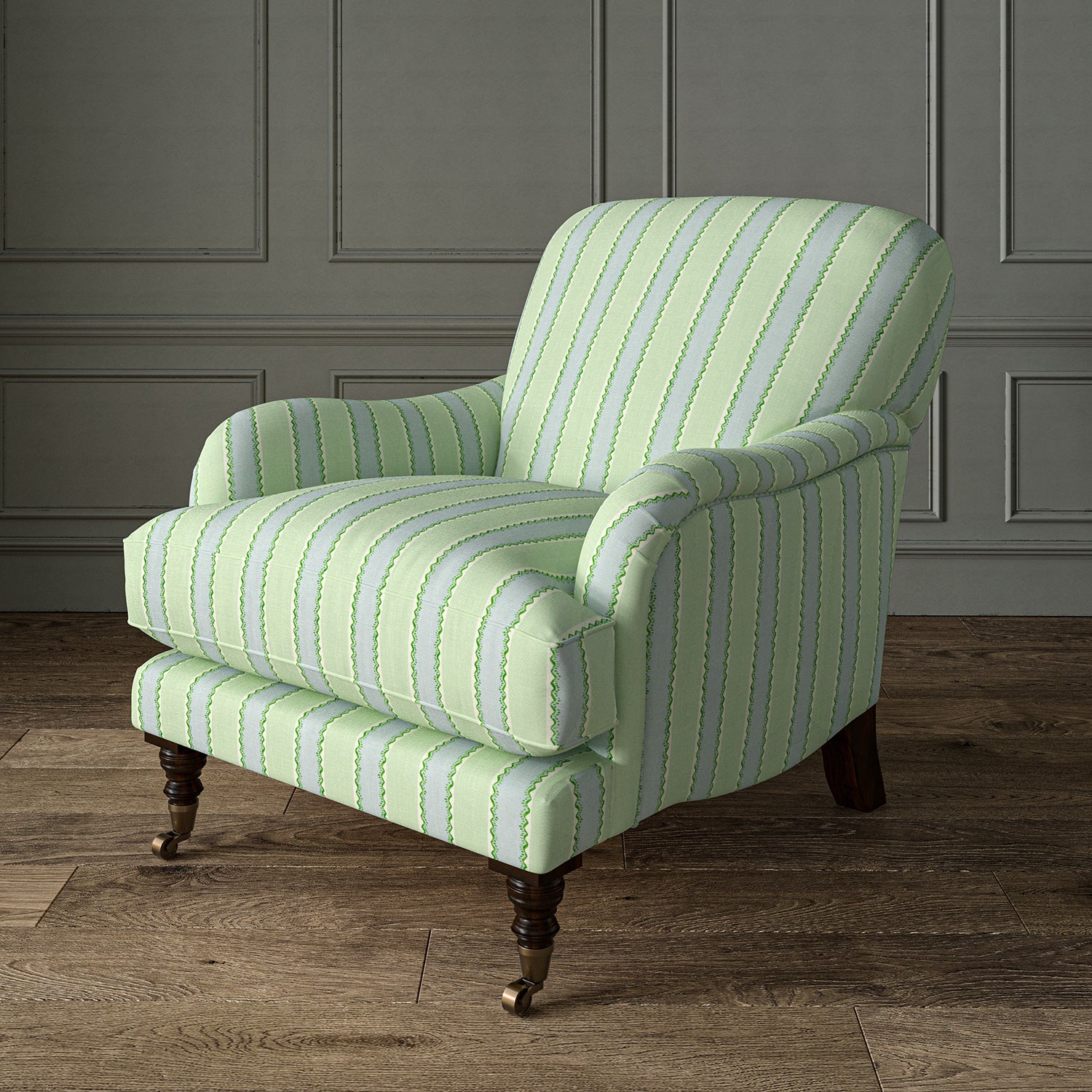 Printed linen fabric – a bold blocks of colour in this inviting stripe are softened with a painterly finish in blue, green and white – on an armchair