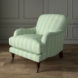Printed linen fabric – a bold blocks of colour in this inviting stripe are softened with a painterly finish in blue, green and white – on an armchair