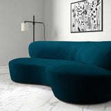 Sofa upholstered in a blue velvet upholstery fabric