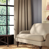 Living room featuring a sofa and curtains in a plain light neutral eco-friendly fabric