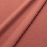 Fabric swatch of a eco-friendly plain terracotta fabric for curtains and upholstery