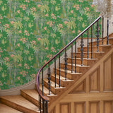 Hallway with a tropical wallpaper in emerald green with exotic, floral blossoms intertwined with bamboo.