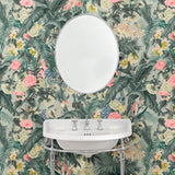 Bathroom with tropical wallpaper featuring a lush design.