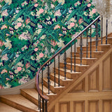 Hallway featuring a smart, tropical wallpaper.