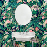Bathroom featuring a smart, tropical wallpaper.