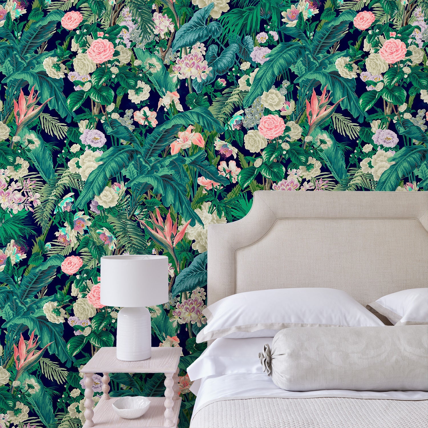 Bedroom featuring a smart, tropical wallpaper.