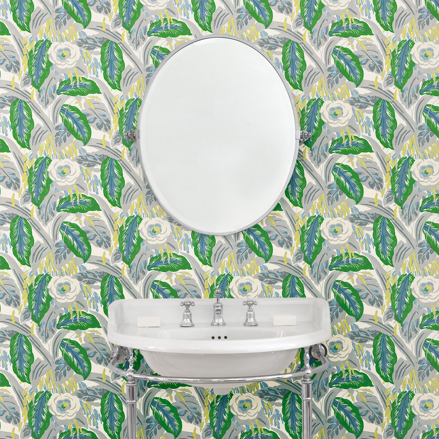 Bathroom with a green floral wallpaper.