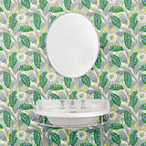 Bathroom with a green floral wallpaper.