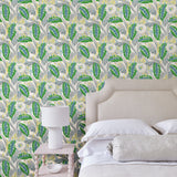 Bedroom with a green floral wallpaper.