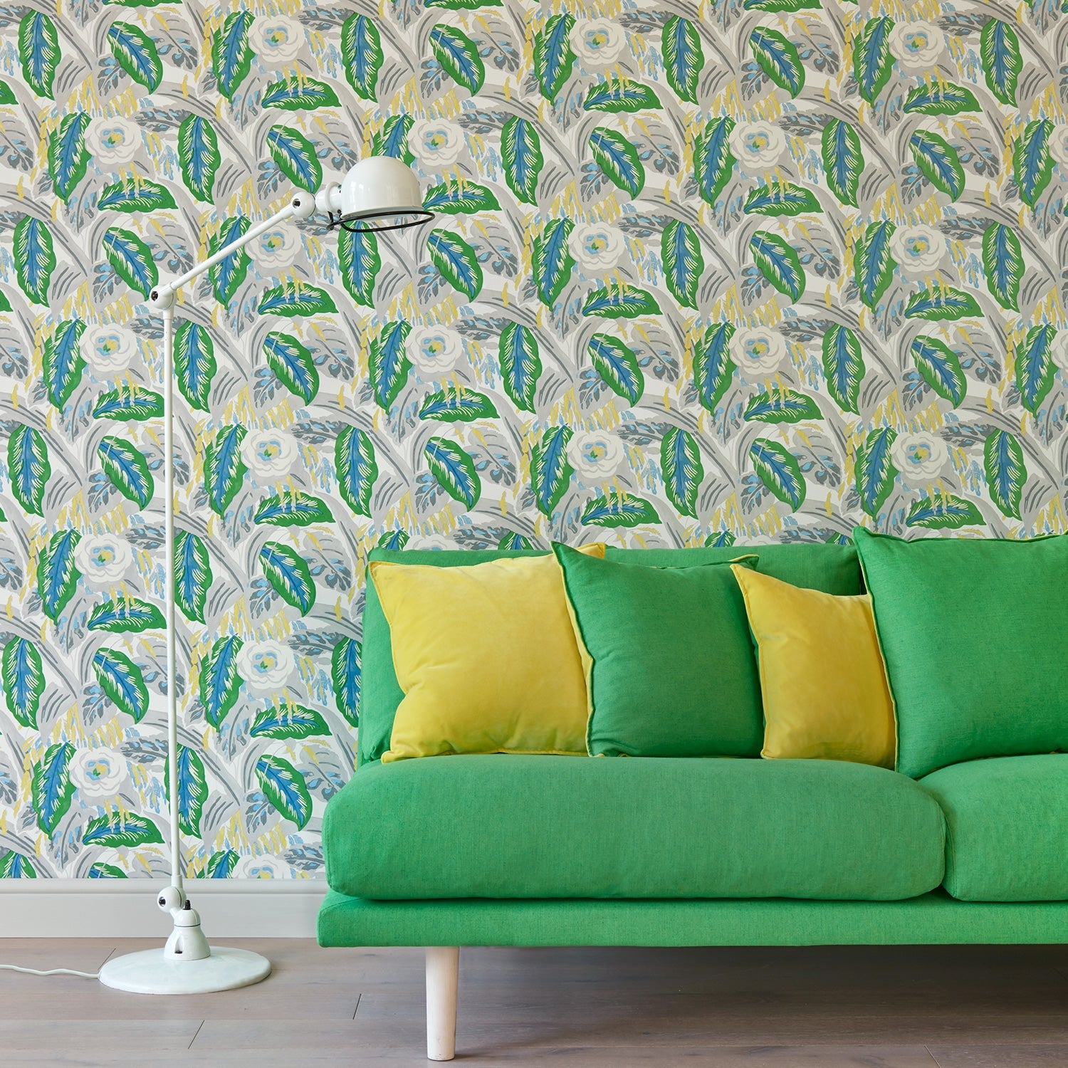 Living room with a green floral wallpaper.