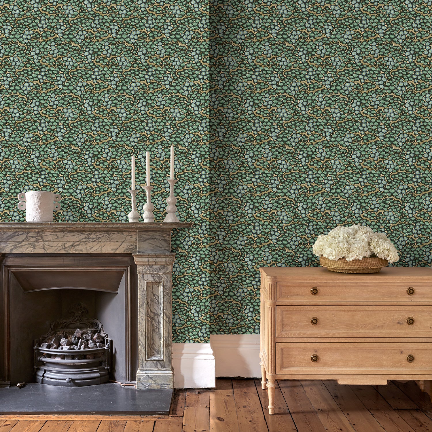 Capturing the beauty of the forest floor, this designer wallpaper features leaves and flowers.
