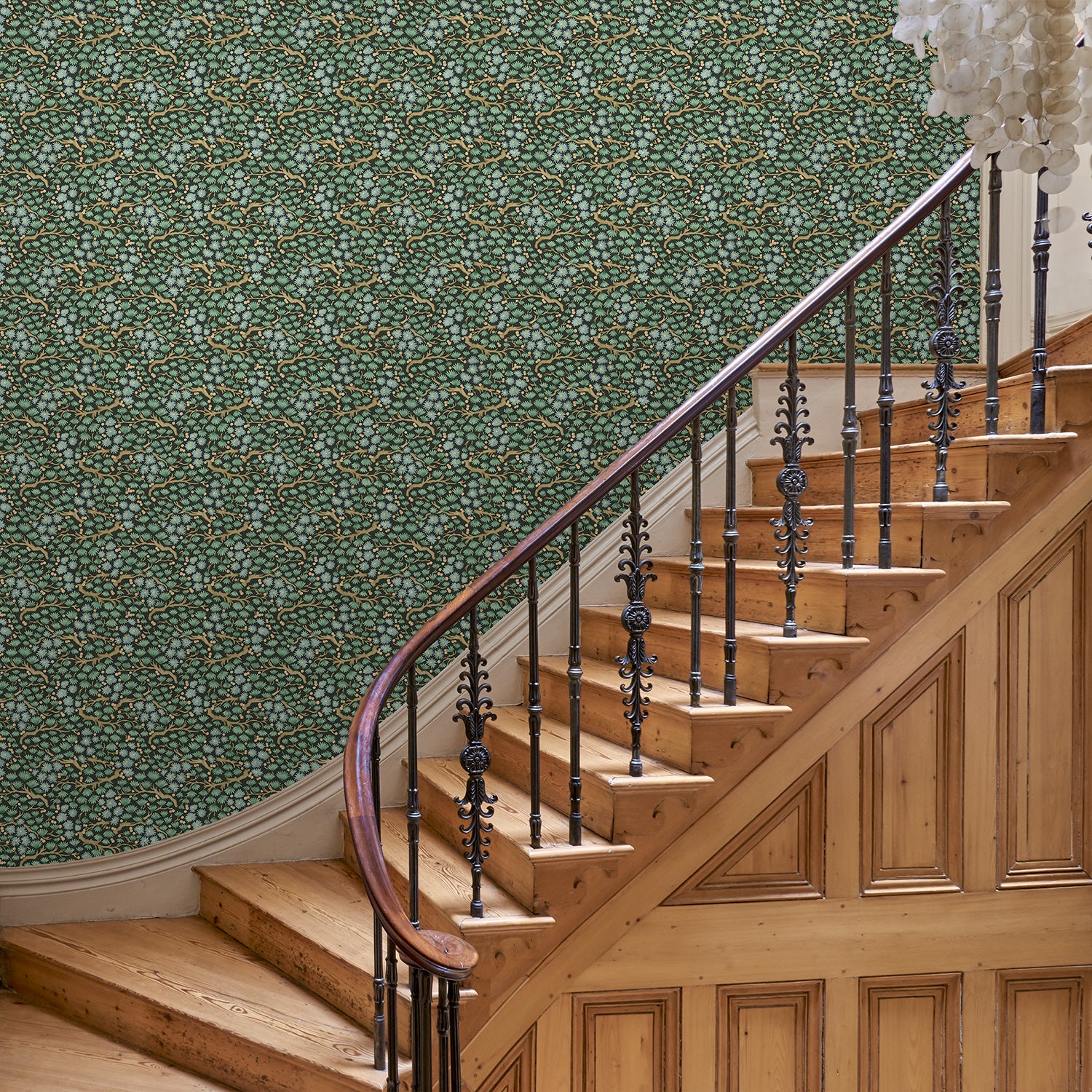 Capturing the beauty of the forest floor, this designer wallpaper features leaves and flowers.