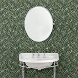 Capturing the beauty of the forest floor, this designer wallpaper features leaves and flowers.