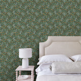 Capturing the beauty of the forest floor, this designer wallpaper features leaves and flowers.