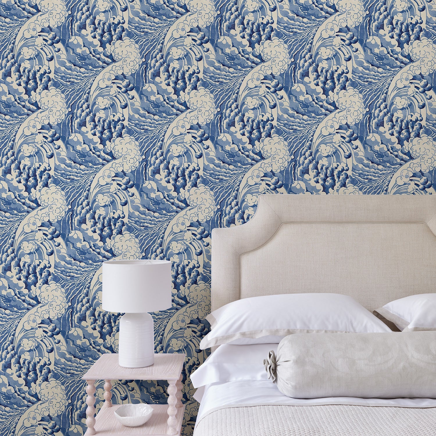 Bedroom with stylish abstract wallpaper featuring dramatic, undulating waves.