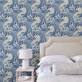 Bedroom with stylish abstract wallpaper featuring dramatic, undulating waves.