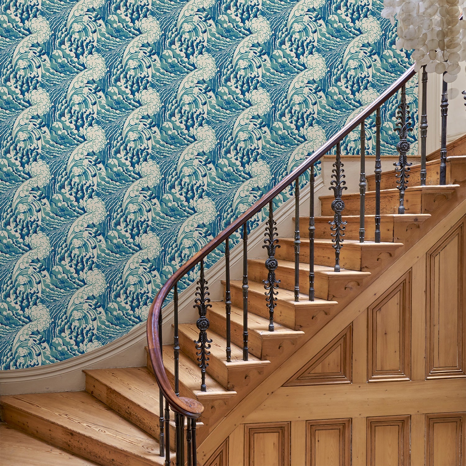 Hallway with stylish abstract wallpaper featuring dramatic, undulating waves.