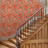 Hallway with a tropical wallpaper in chilli showcasing beautiful botanicals and butterflies.