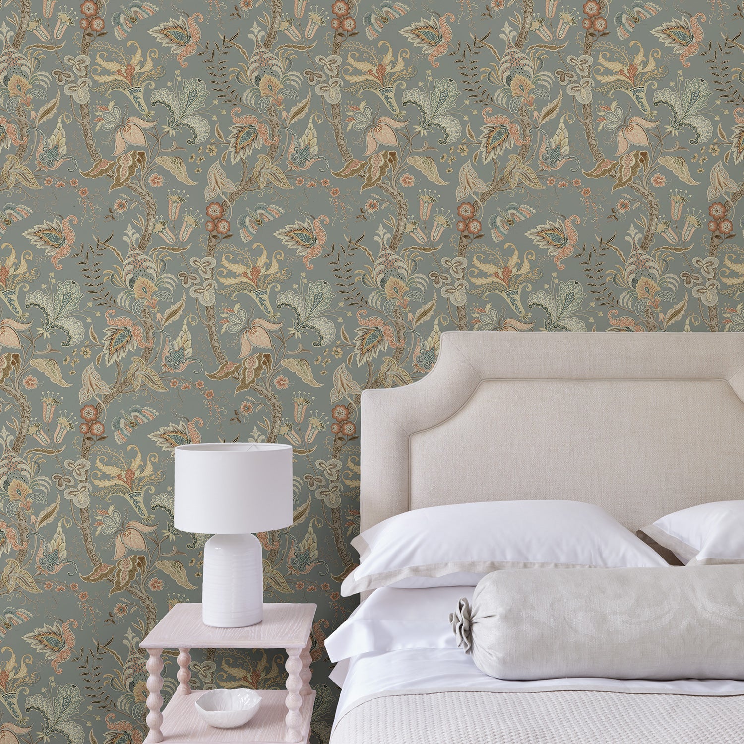 Bedroom with a tropical wallpaper in a smart neutral showcasing beautiful botanicals and butterflies.