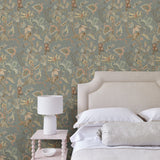 Bedroom with a tropical wallpaper in a smart neutral showcasing beautiful botanicals and butterflies.