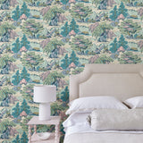 Bedroom showcasing a pastel wallpaper featuring a landscape of mountains, willows and Oriental-style buildings.