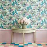 Sitting room showcasing a pastel wallpaper featuring a landscape of mountains, willows and Oriental-style buildings.