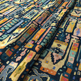 Printed velvet fabric with city buildings in blue and yellow colours for curtains and upholstery.