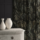 A printed velvet fabric showcasing stylised wisteria in green and brown, as curtains