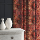Curtain made from a terracotta printed velvet fabric based on a classic Persian rug design.