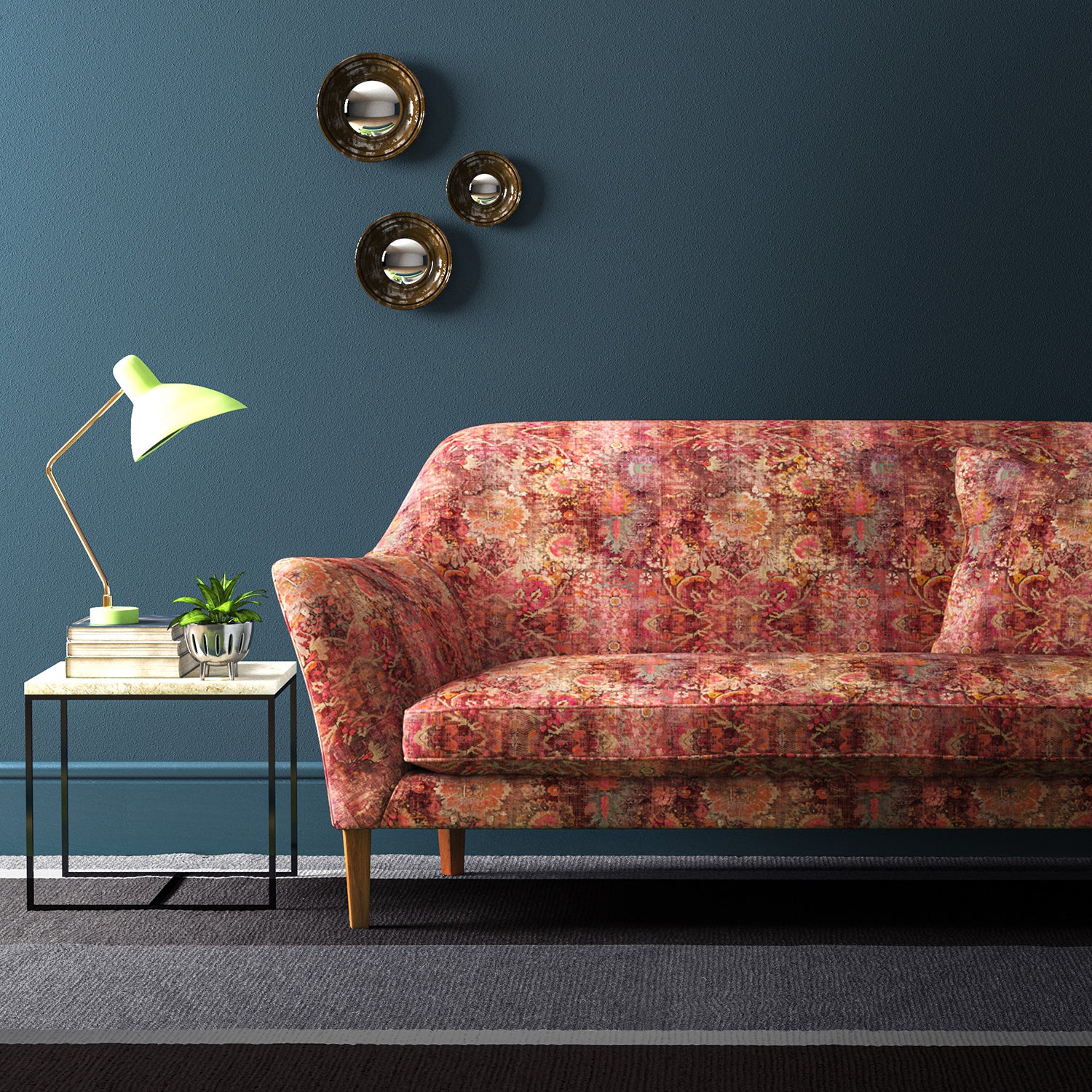 Sofa covered in a terracotta printed velvet fabric based on a classic Persian rug design.
